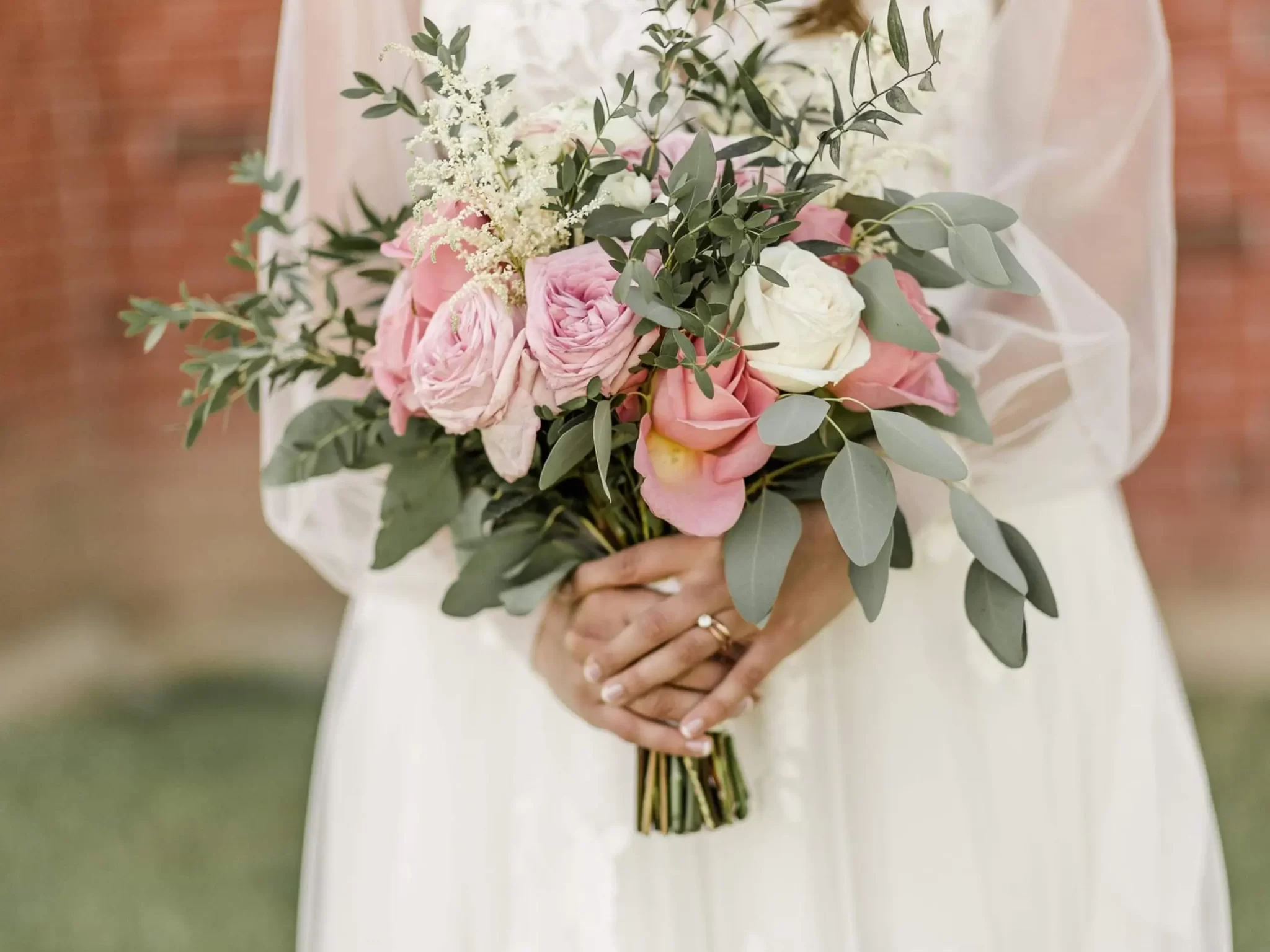Bride holding hand delivered beautiful bouquets
